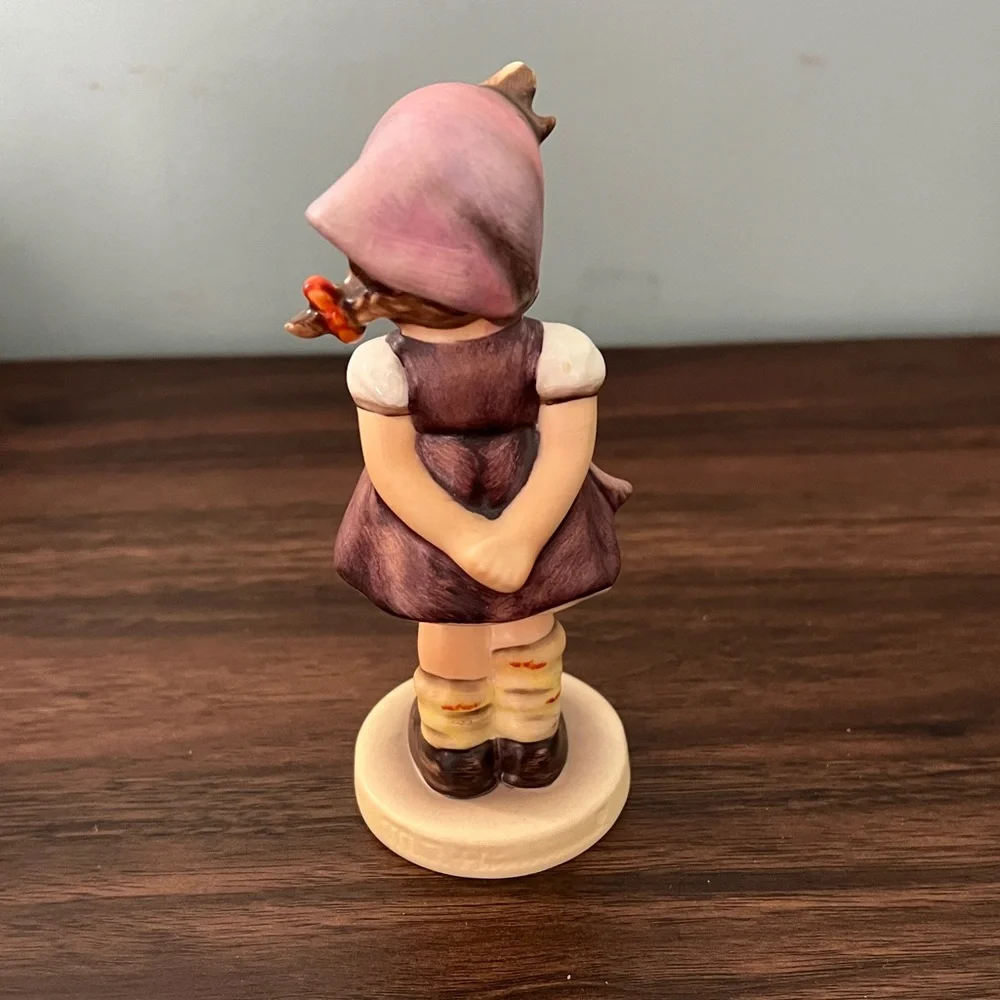 Charming Figurine with Purple and Brown Accents